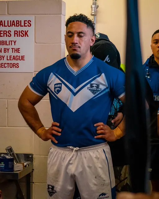 Rugby league player concentrating in the changing room before a match